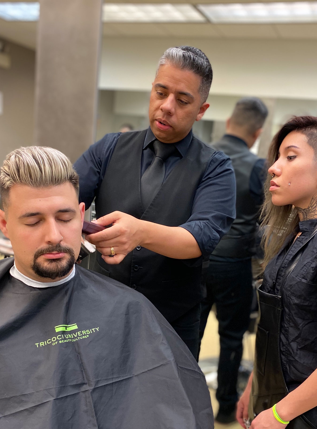 Tricoci University Student Cutting Customer's Hair