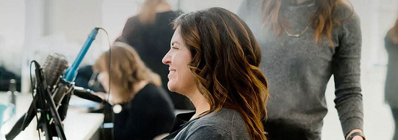 woman smiling in mirror