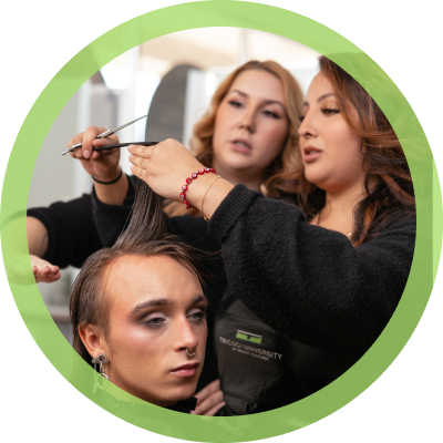 student cutting hair with teacher