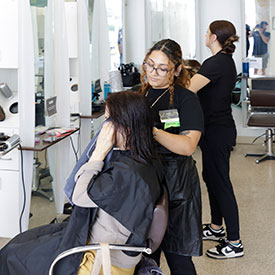 Tricoci student practicing techniques on client