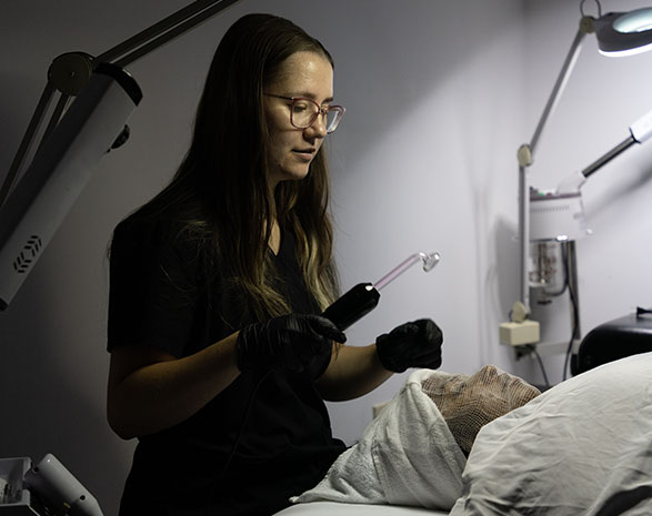 Tricoci student learning Esthetics at Normal, IL location