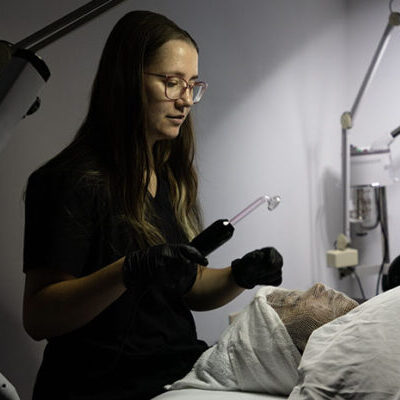 Tricoci student practicing skincare treatment
